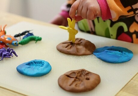 Bug Activities For Toddlers - Playdough Bug Fossils